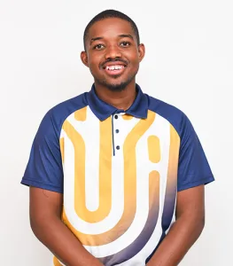 Smiling man in a blue polo with a bold yellow and white graphic pattern against a white background.