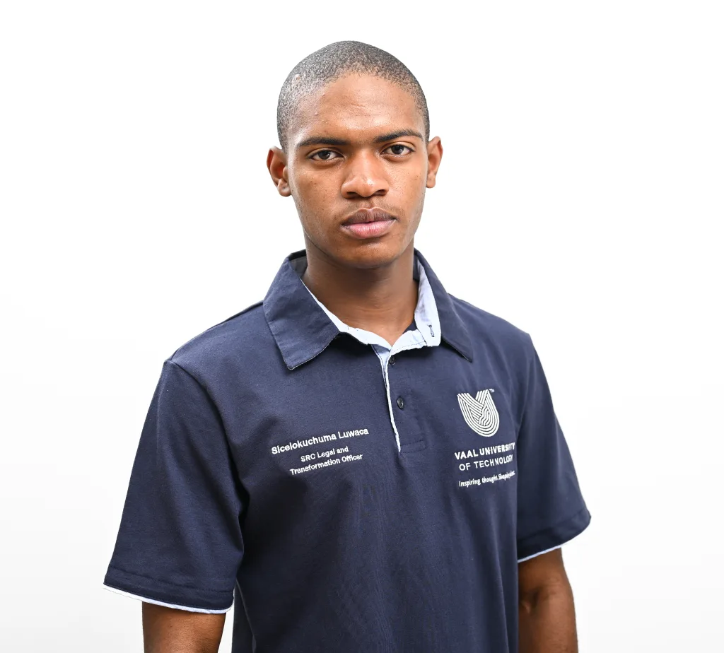Portrait of a person in a navy polo shirt with white piping and a crest emblem against a white background